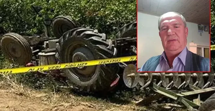 Devrilen traktörün altında kaldı