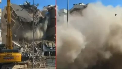 Aydın’ın Kuşadası ilçesinde, kentsel dönüşüm kapsamında boşaltılan 5 katlı bina, yıkım çalışması