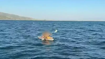Aydın'ın Söke ilçesinde, kürek sörfü yaparken denizde sürüklenen 2 kişi,
